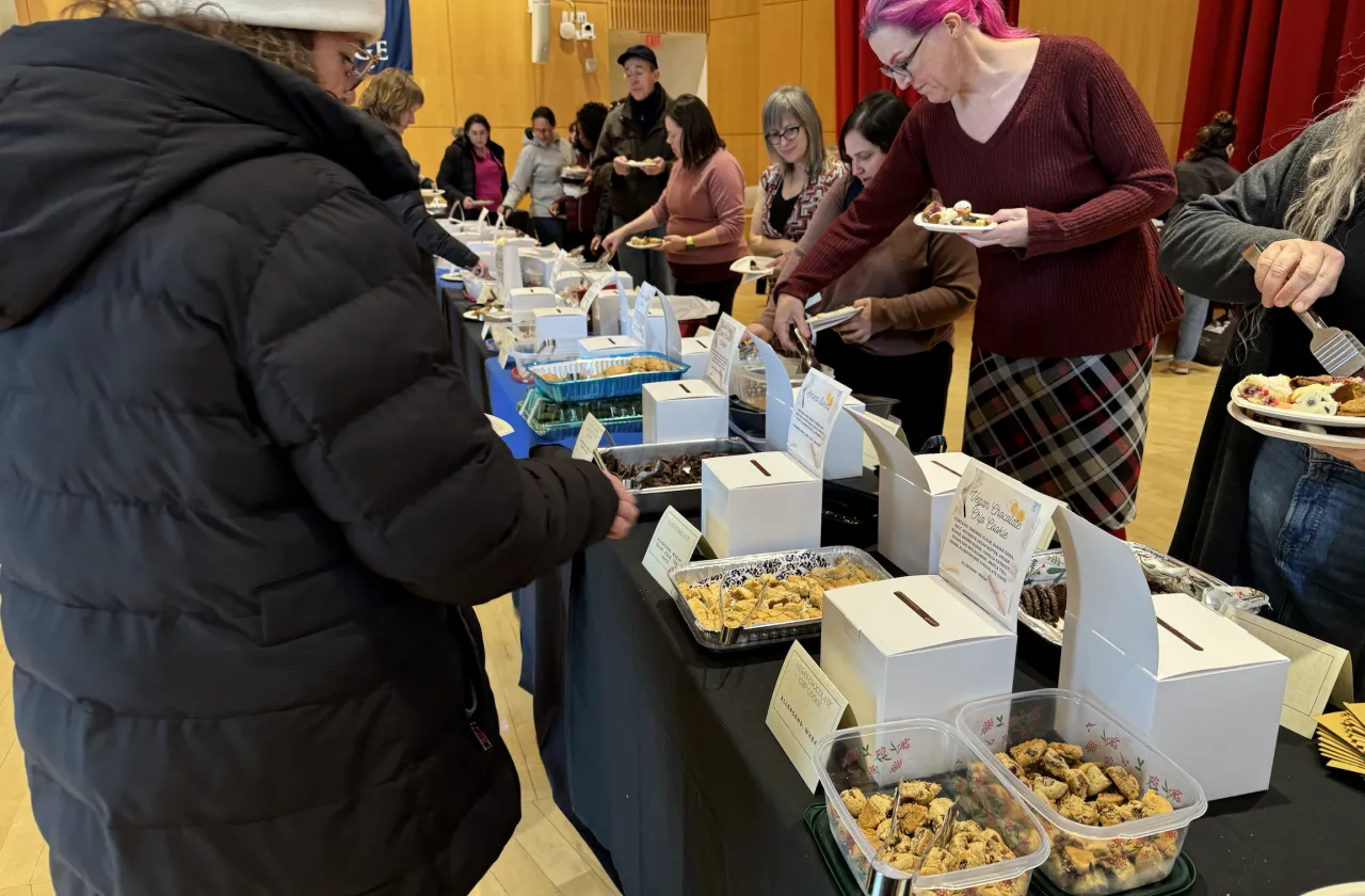 Staff members sample cookies