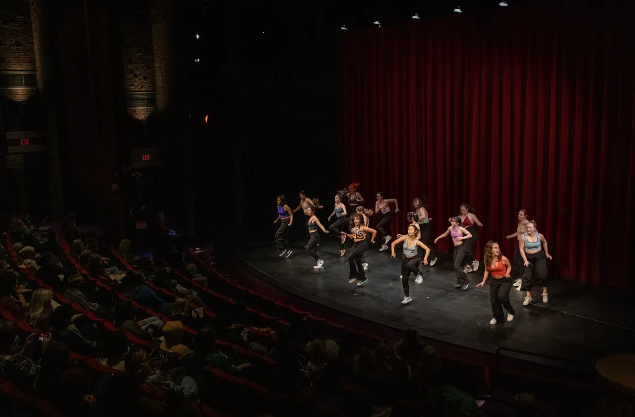 Students on stage dancing