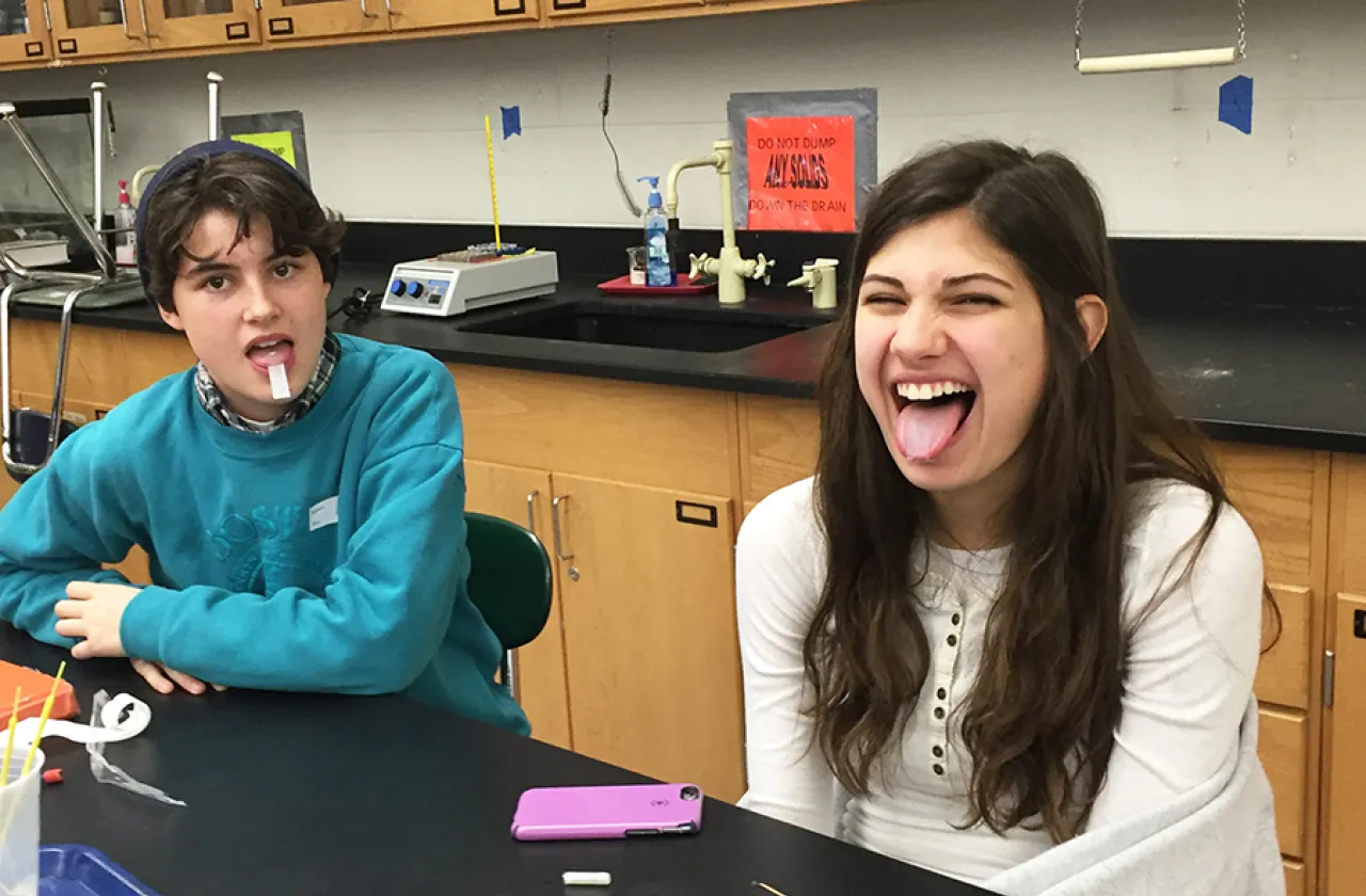 Northampton High School students try paper soaked in PTC, a substance that tastes bitter to some but is tasteless to others.