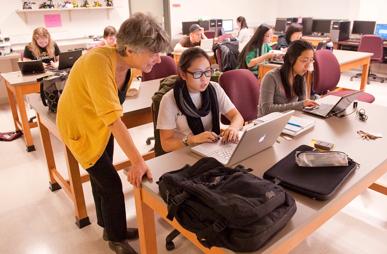 Ileana Streinu and a student working in a computer lab