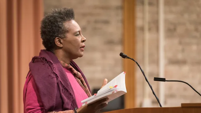 Claudia Rankine reading at the podium