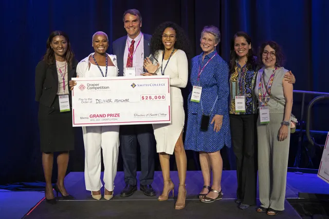 The winning team with Draper Competition judges (l to r) Dawanna Williams ’90, Chanté Knox, Tim Draper, Dia Davis, Melissa Draper, S. Mona Ghosh Sinha ’88 and Abigail Slater ’80.