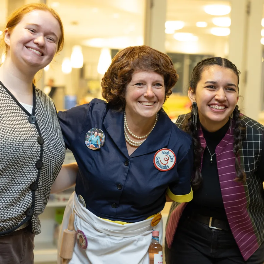 Tina Atkinson poses with students while dressed as Julia Child