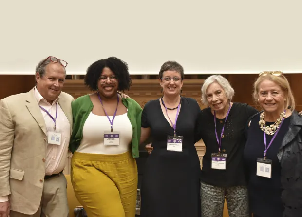 Professor Robert Dorit stands with several Smithies at a panel about Smith’s Paris program.