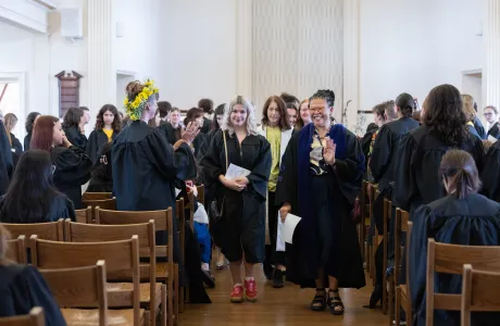 President Sarah and a senior lead a procession out of Helen Hills Hills Chapel after Baccalaureate 2025.