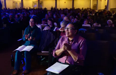 President Sarah clapping while watching a performance during the 2024 Cromwell Day.