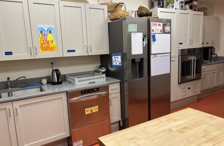The renovated chapel kitchen, featuring stainless steel appliances, new cabinetry, and ample work space.