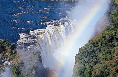 Victoria Falls in Zimbabwe, with a rainbow spanning the falls