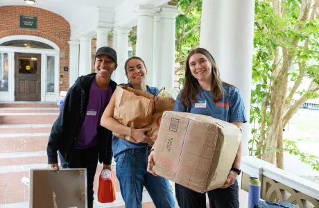 housemates help a new student move belongings into Northrop-Gillett