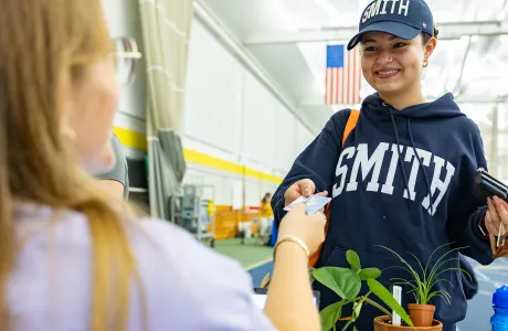 A new student receives their OneCard at Central Check-In.