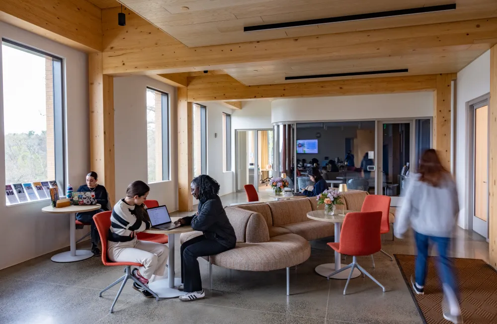 People gather in a common area of Kathleen McCartney Hall