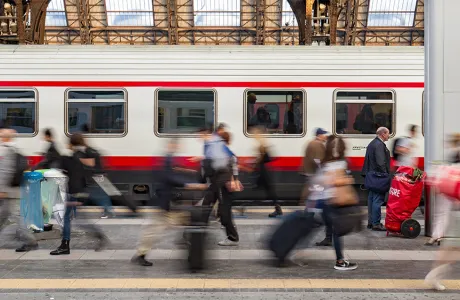 Commuters in a hurry on a train platform