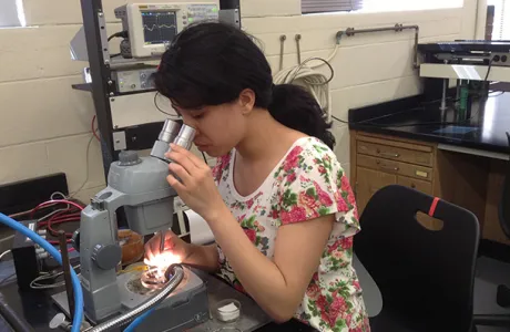 Student Kara at the microscope