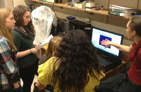 Neuroscience students reviewing data in the lab