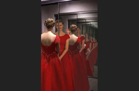 "Through the Looking Glass" photo of woman looking in a mirror created by Sophia Hager ’21.