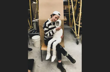 Wells Wells '23 with sculpture, “The Empty Son”