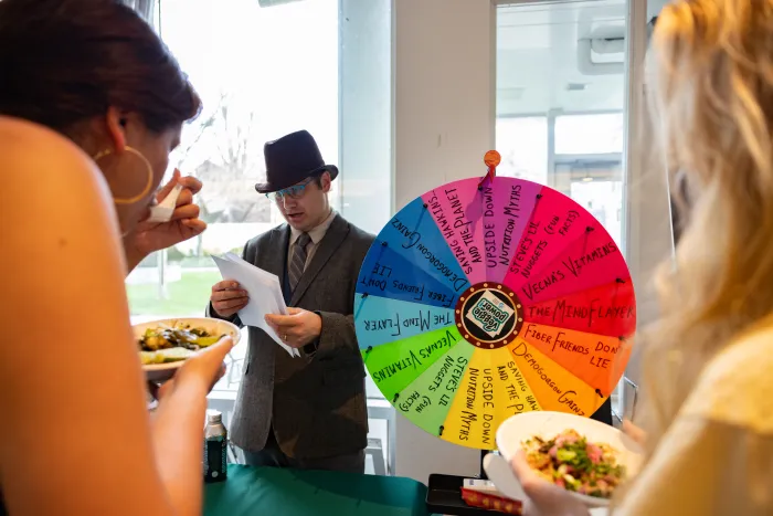 Students spin a wheel of fun facts about plant-based eating.