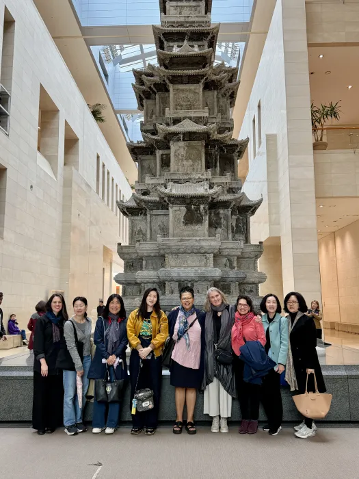 President Sarah Willie LeBreton, members of the Smith College advancement team, and Smith College alums stand inside the National Museum of Korea.