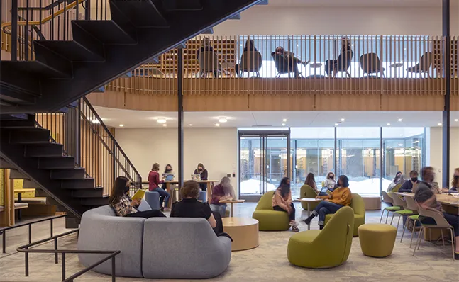Students sitting in a common area in Neilson Library