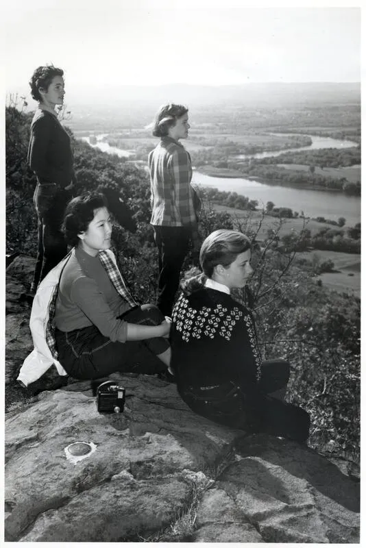 Smith students in 1953 look out over the Connecticut River on Mountain Day
