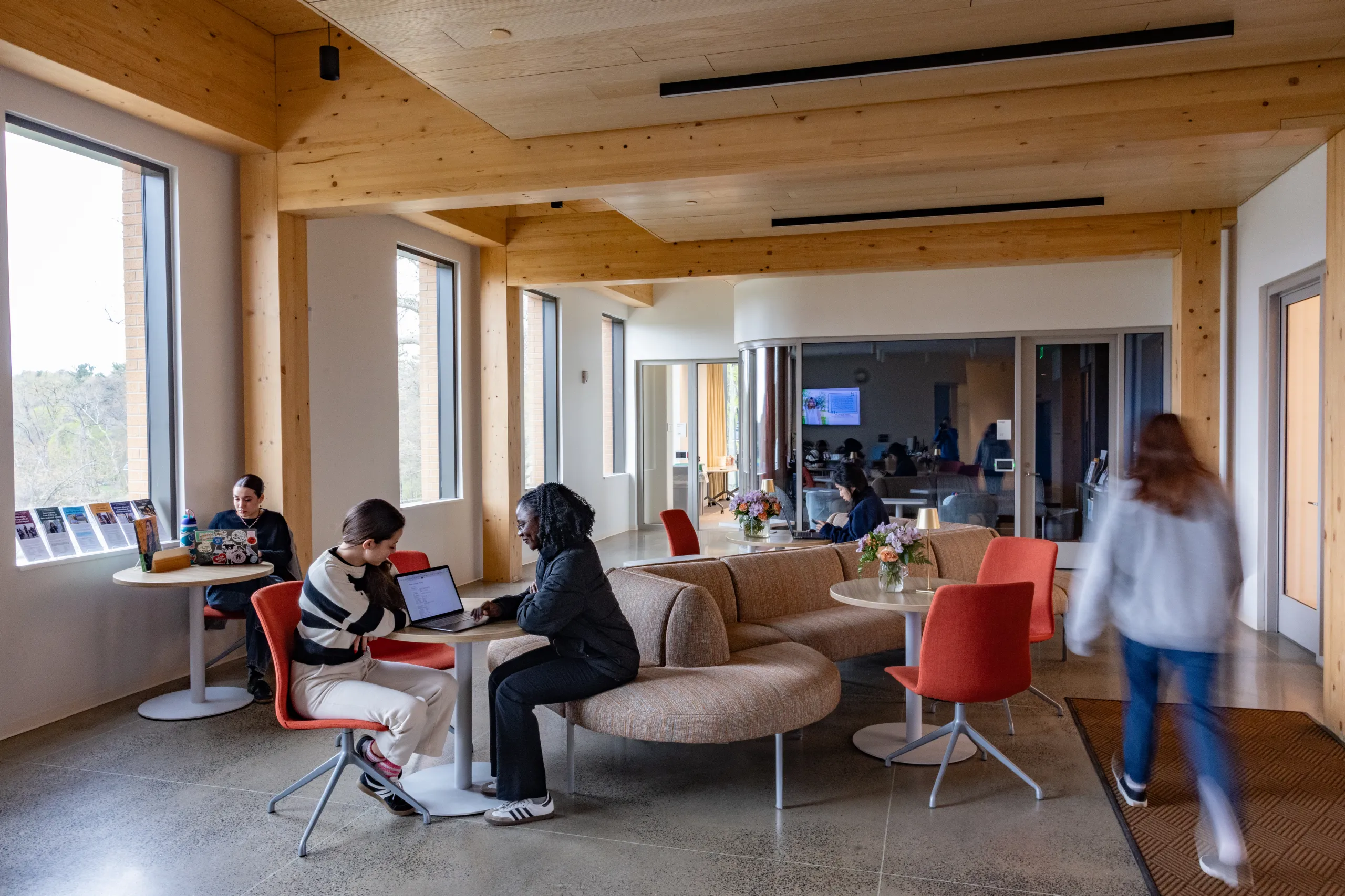 People gather in a common area of Kathleen McCartney Hall