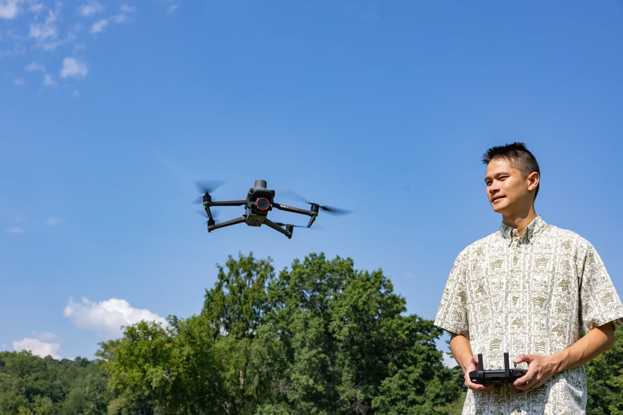 Kala'i Ellis brings Patty the drone in for a landing near Paradise Pond