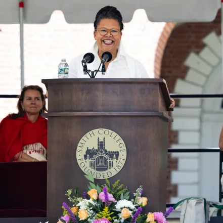 President Sarah Willie-LeBreton smiles at the podium during Ivy Day 2026