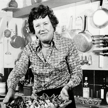 Julia Child presenting a finished dish